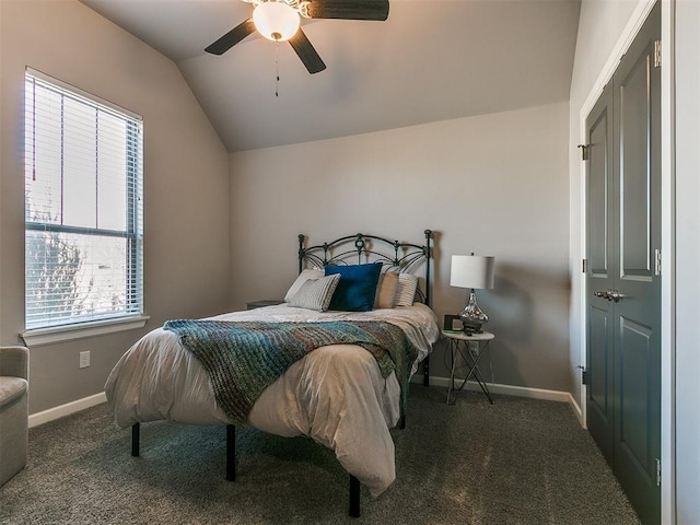 carpeted bedroom with lofted ceiling, a ceiling fan, and baseboards