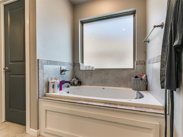 full bathroom with tile patterned flooring and a bath