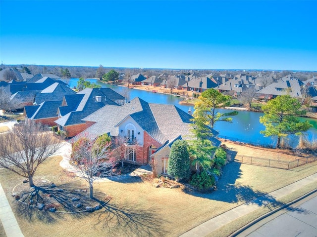 aerial view with a water view and a residential view