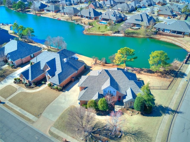 birds eye view of property featuring a residential view and a water view