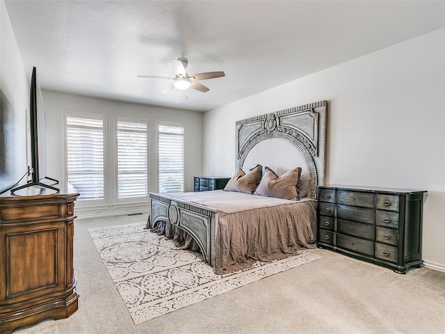 carpeted bedroom featuring a ceiling fan