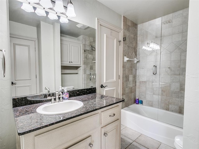 full bathroom with enclosed tub / shower combo, vanity, toilet, and tile patterned floors