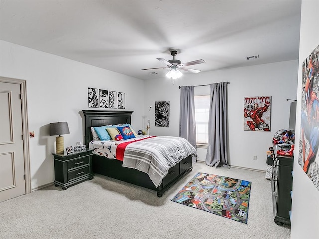 bedroom with carpet floors, visible vents, and a ceiling fan