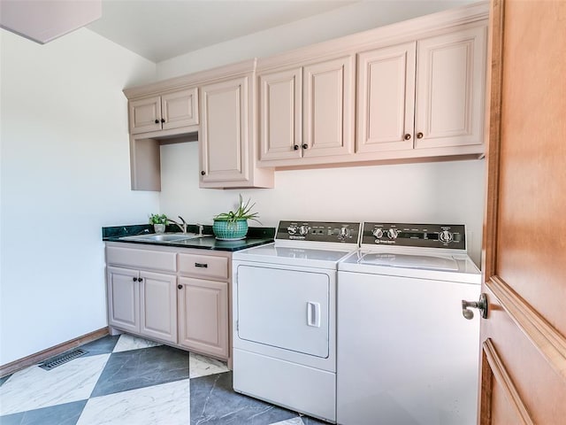 clothes washing area featuring a sink, visible vents, marble finish floor, independent washer and dryer, and cabinet space