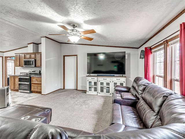 living area with ornamental molding, lofted ceiling, light colored carpet, and a textured ceiling