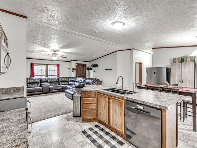 kitchen with stove, ornamental molding, open floor plan, a sink, and dishwasher