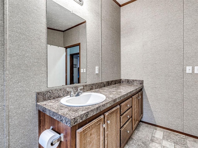 bathroom with vanity and crown molding