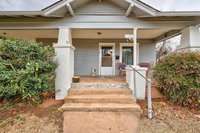 property entrance featuring covered porch