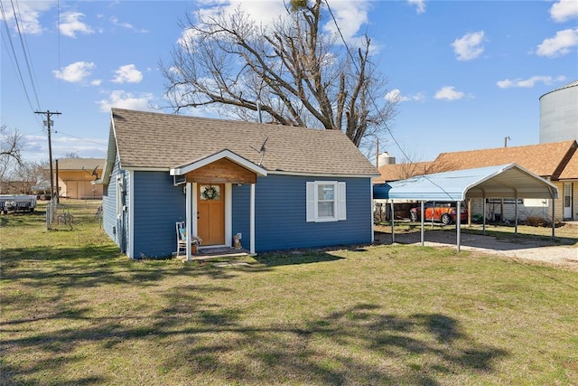 bungalow-style house featuring a carport, a shingled roof, a front yard, and fence