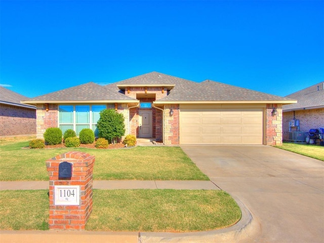 view of front of home with a garage, a front yard, brick siding, and driveway