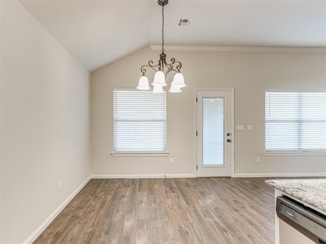 unfurnished dining area with light wood finished floors, baseboards, visible vents, an inviting chandelier, and vaulted ceiling