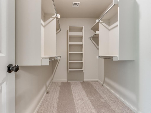 spacious closet featuring carpet floors and visible vents