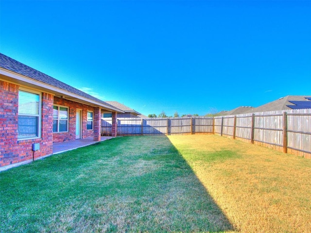 view of yard featuring a fenced backyard