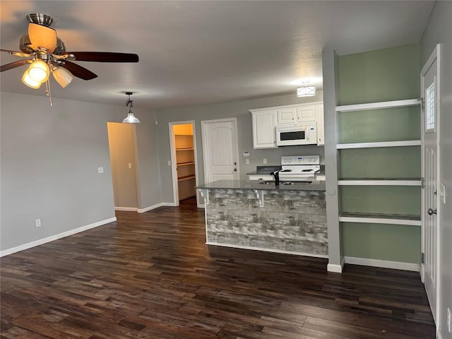 kitchen with ceiling fan, baseboards, white cabinets, white appliances, and dark wood-style flooring