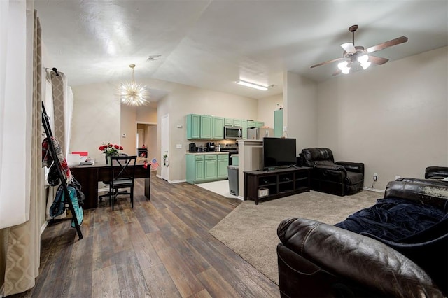 living room with lofted ceiling, baseboards, dark wood-type flooring, and ceiling fan with notable chandelier