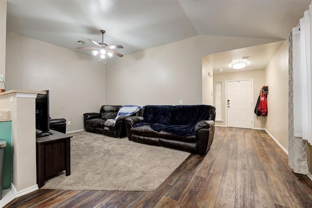 living area featuring ceiling fan, baseboards, vaulted ceiling, and wood finished floors