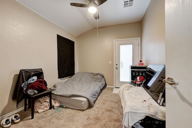 carpeted bedroom with vaulted ceiling, ceiling fan, visible vents, and baseboards