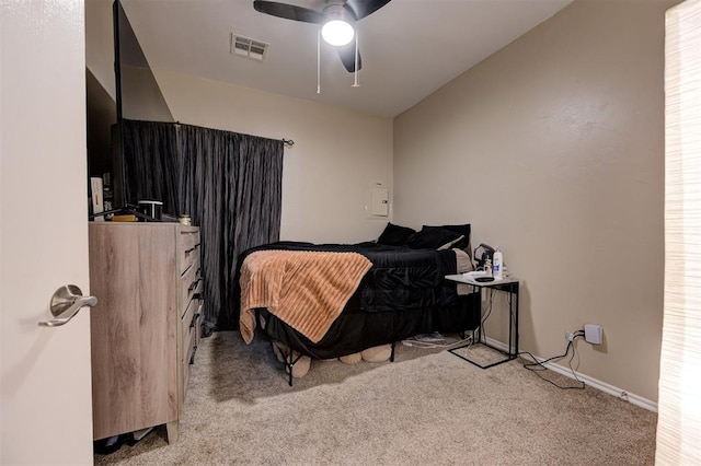 bedroom with light carpet, baseboards, visible vents, and a ceiling fan