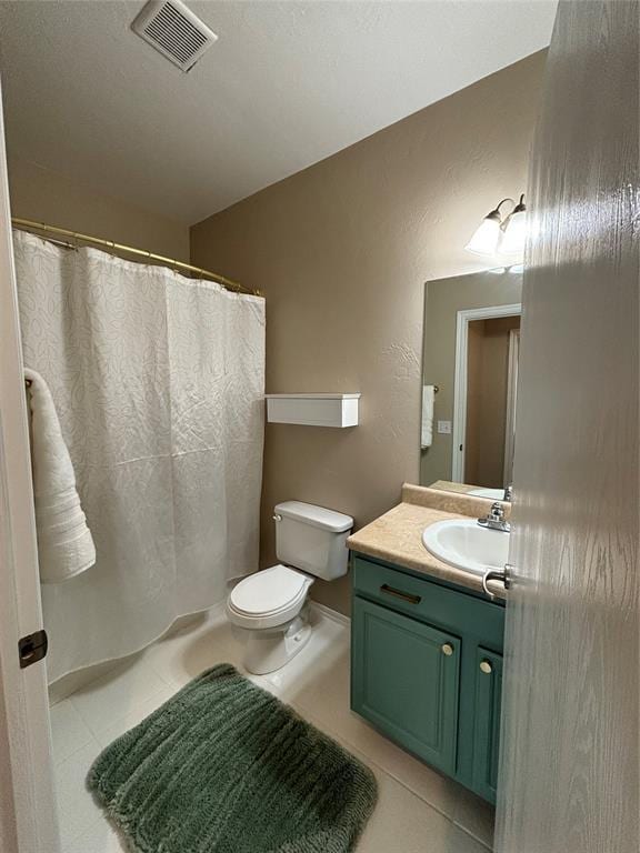 bathroom with tile patterned flooring, toilet, a shower with shower curtain, vanity, and visible vents