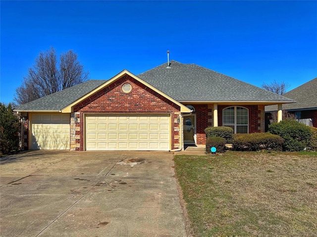 view of front of house with driveway, brick siding, roof with shingles, and an attached garage