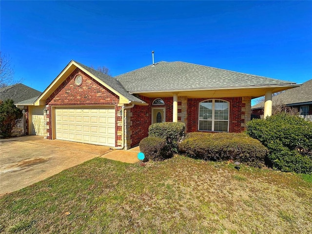 ranch-style house featuring driveway, brick siding, a shingled roof, an attached garage, and a front yard