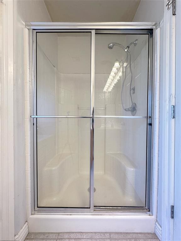 bathroom featuring a shower stall