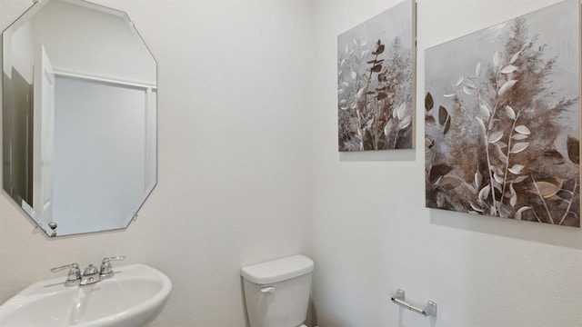 bathroom featuring a sink and toilet