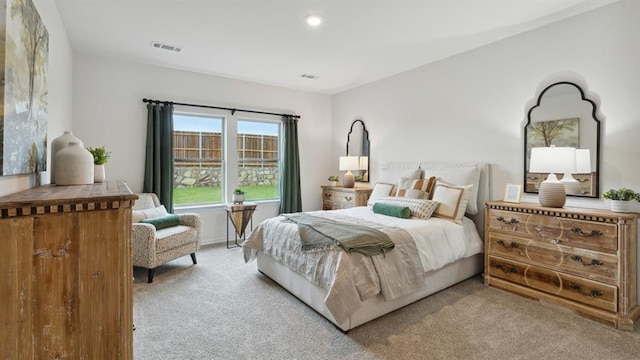 bedroom with recessed lighting, visible vents, and light colored carpet