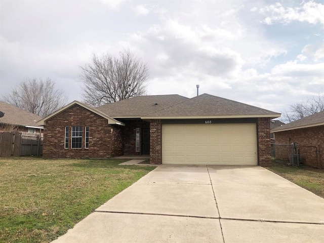 ranch-style house featuring driveway, a garage, brick siding, fence, and a front yard