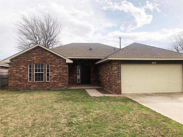 ranch-style house featuring a front yard, concrete driveway, and brick siding