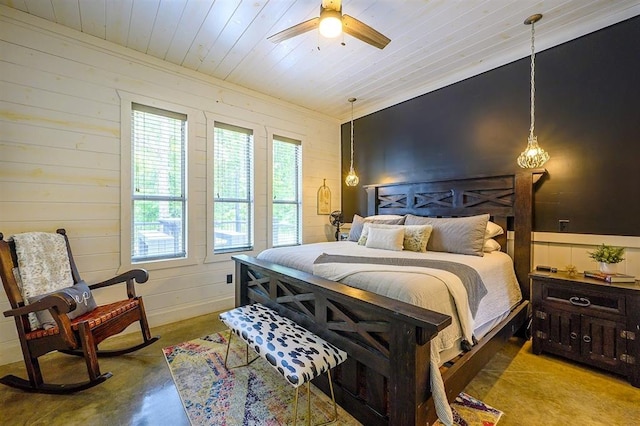 bedroom featuring finished concrete flooring, wooden ceiling, and a ceiling fan