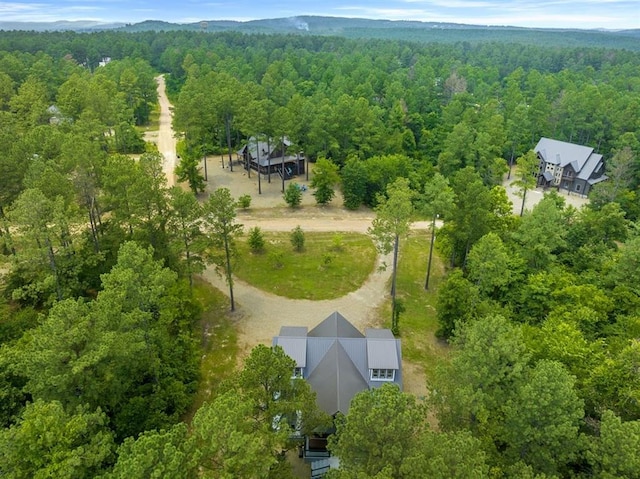 drone / aerial view with a view of trees