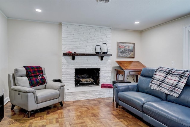 living room with ornamental molding, a fireplace, visible vents, and recessed lighting