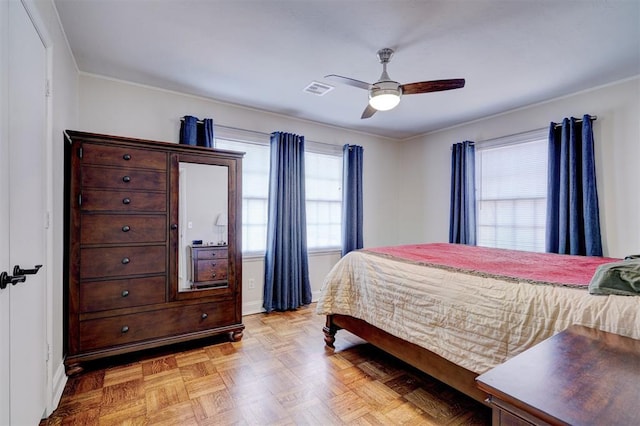 bedroom featuring a ceiling fan and visible vents