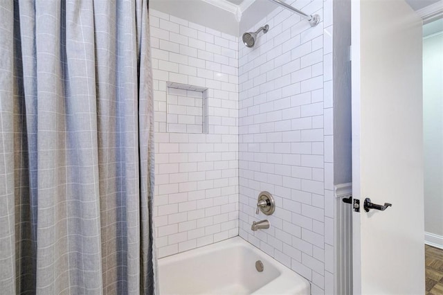 full bathroom with ornamental molding and shower / tub combo