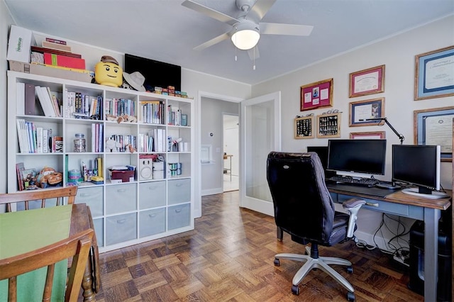 office with ceiling fan and baseboards