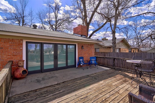 wooden terrace with french doors and fence