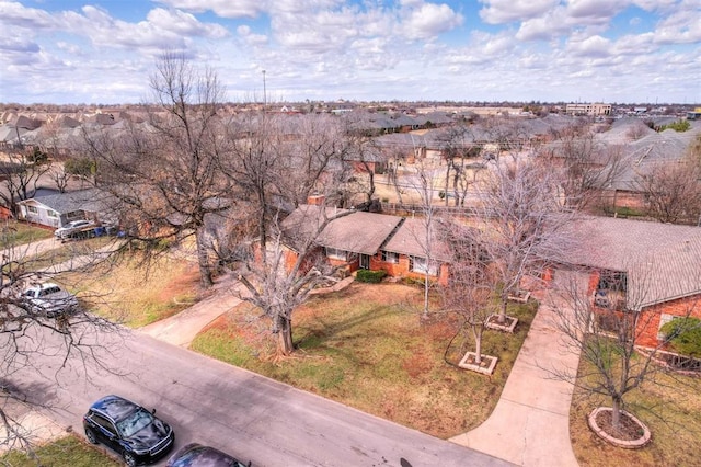 birds eye view of property with a residential view