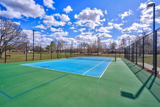 view of sport court with fence