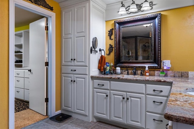 full bathroom featuring vanity and a tile shower