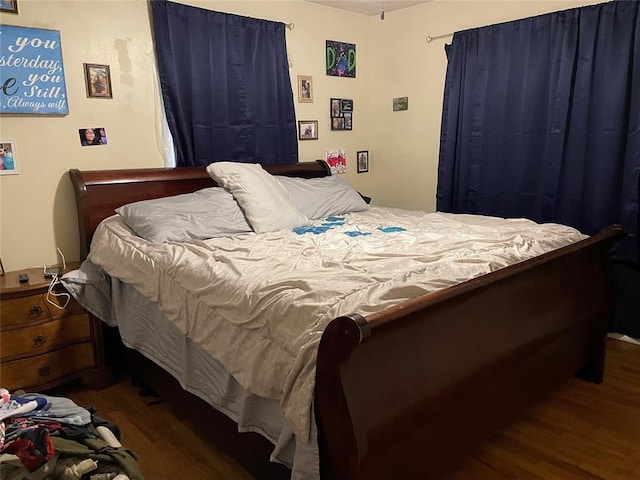 bedroom featuring wood finished floors