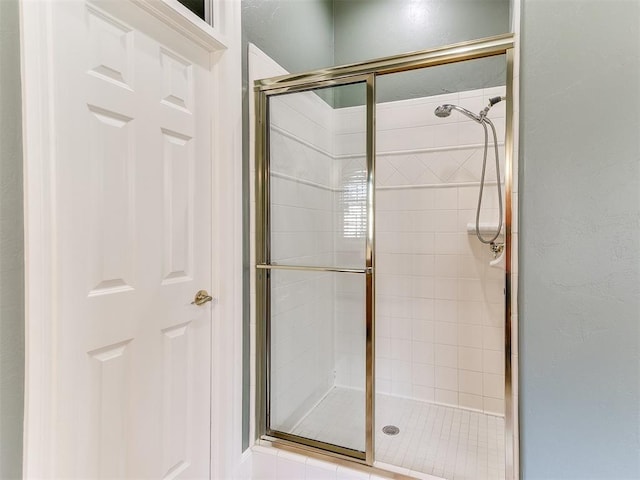 full bathroom featuring a shower stall