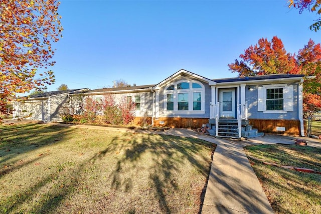 view of front of home featuring a front yard and crawl space