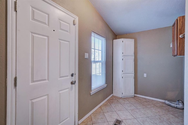 interior space featuring visible vents, baseboards, and light tile patterned flooring