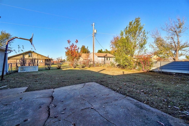 view of yard featuring fence and a patio