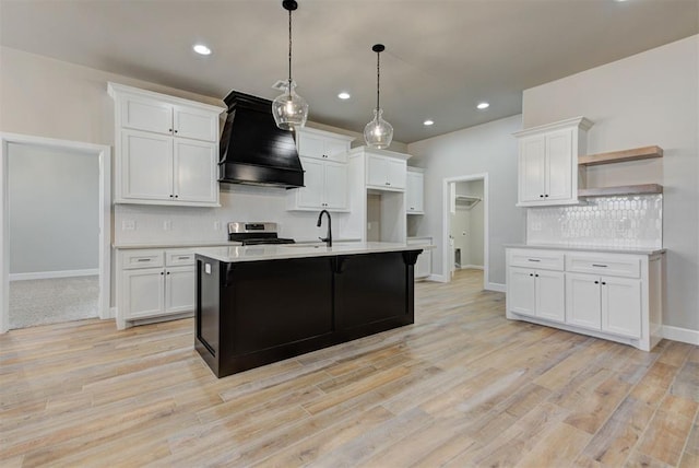 kitchen featuring premium range hood, open shelves, light countertops, and stainless steel range with electric cooktop