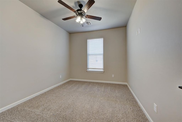 unfurnished room featuring baseboards, visible vents, carpet floors, and ceiling fan