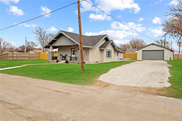 106 N Dewey St, Corn, OK 73024 - view of front of home featuring an outdoor structure, fence, a garage, a front lawn, and a porch