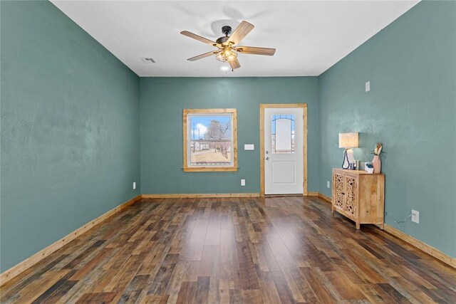 106 N Dewey St, Corn, OK 73024 - foyer with baseboards, visible vents, hardwood / wood-style flooring, and a ceiling fan