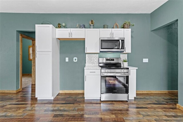106 N Dewey St, Corn, OK 73024 - kitchen featuring backsplash, white cabinets, stainless steel appliances, and dark wood-type flooring